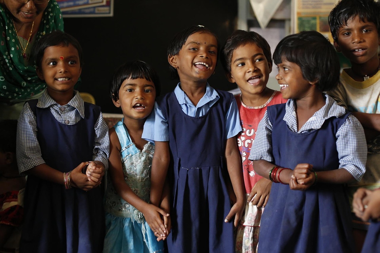 Happy daycare teacher with children